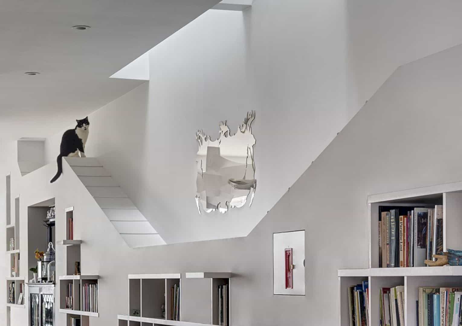 A Lively And Light Filled Home Design For A Cat And Book Lover 11