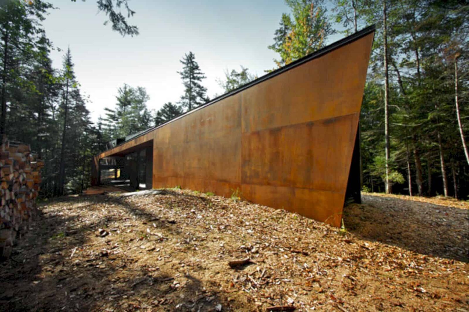 Geometry In Black A Three Block Black Building In Quebecs Dense Forest 7