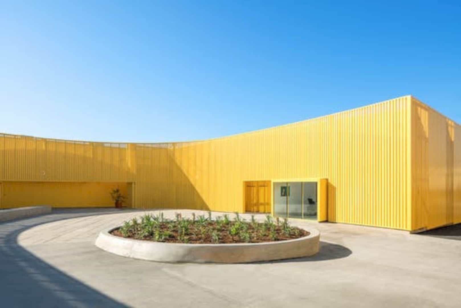 Animo South Los Angeles High School A Bright Yellow Campus Building In Sunny La Atmosphere 8