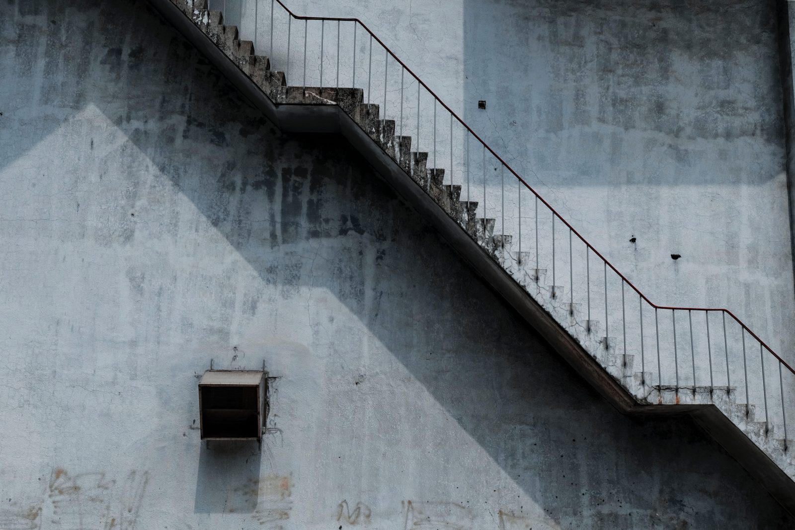 Brown Metal Staircase And Gray Painted Wall 1246078