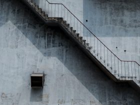 Brown Metal Staircase And Gray Painted Wall 1246078