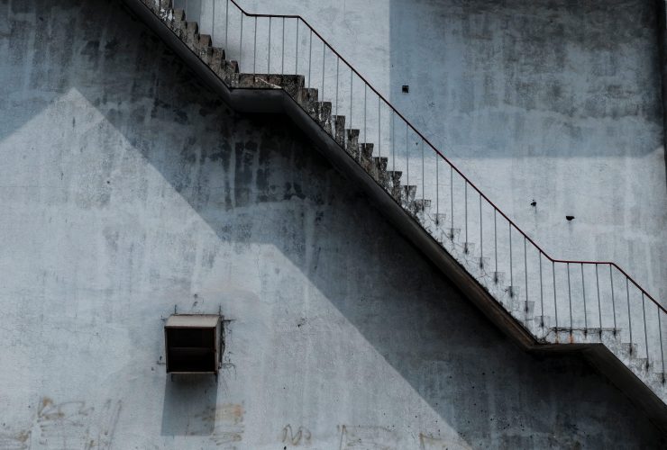 Brown Metal Staircase And Gray Painted Wall 1246078