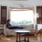 Woman Sitting On Sofa In Living Room 1595589