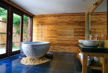 Round White And Gray Ceramic Bathtub Inside Brown Room 2134224