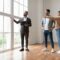 Estate Agent Showing Prospective Buyers Around Property