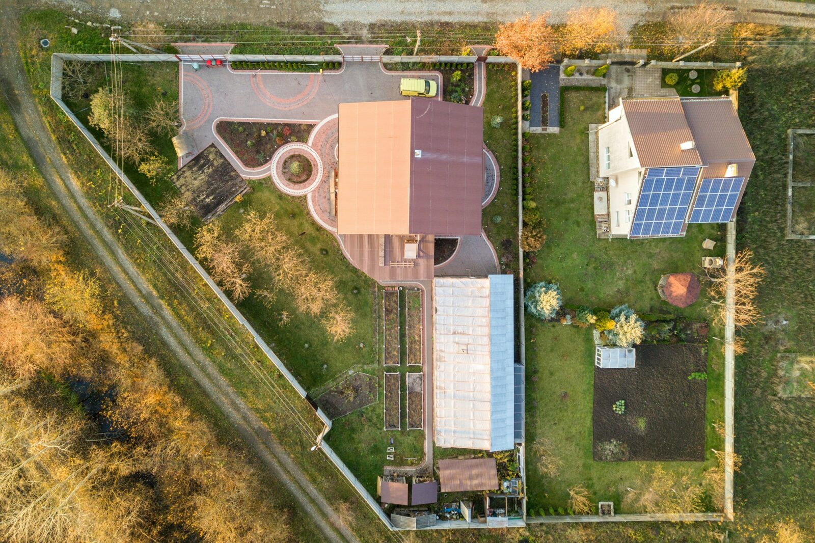 Aerial landscape of small town or village with rows of residential homes and green trees