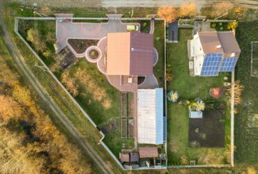 Aerial landscape of small town or village with rows of residential homes and green trees