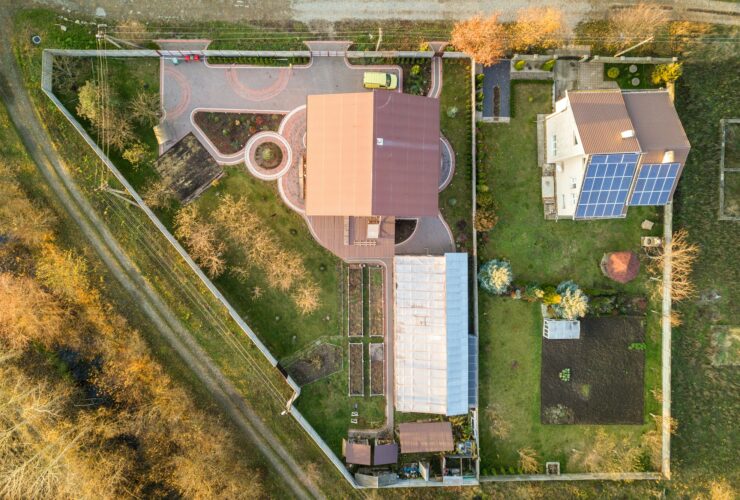 Aerial landscape of small town or village with rows of residential homes and green trees