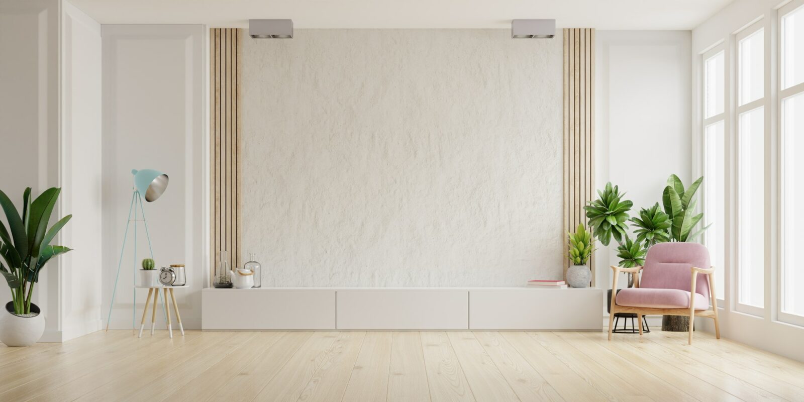 Cabinet for TV on the white plaster wall.