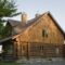 Exterior of cottage style log house with cedar shingles