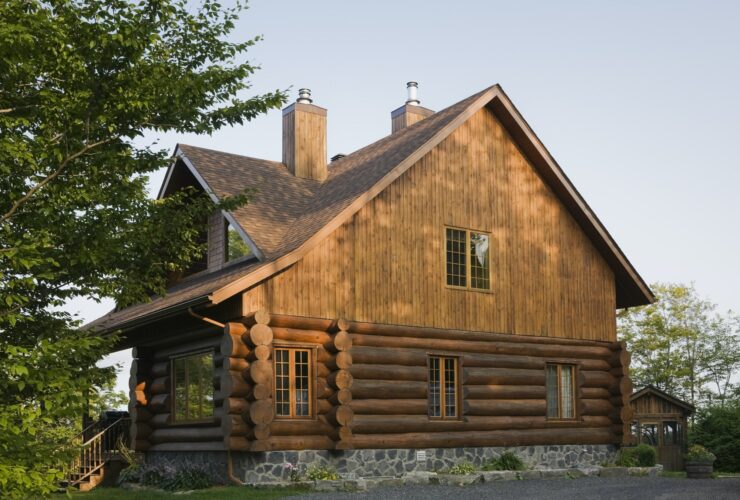 Exterior of cottage style log house with cedar shingles