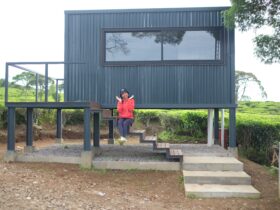 Happy People In Front Of Small House 2022 02 10 07 42 38 Utc
