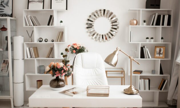 home office in light shades and colors, white desk chair, white book shelves