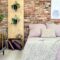 Industrial bedroom with pink bedding