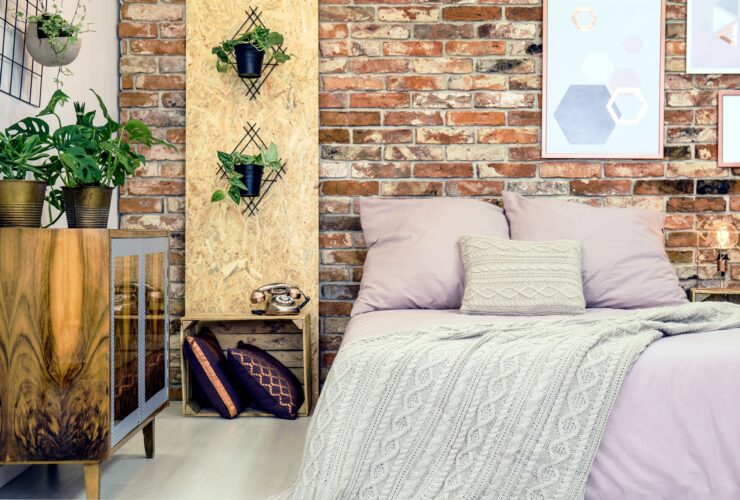 Industrial bedroom with pink bedding