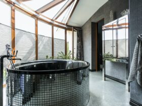 Luxurious bathroom with freestanding glossy bathtub