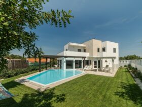 Modern house with garden swimming pool and wooden pergula