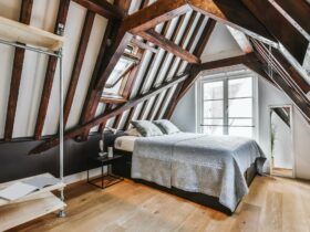 Stylish attic bedroom with a soft bed