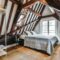 Stylish attic bedroom with a soft bed
