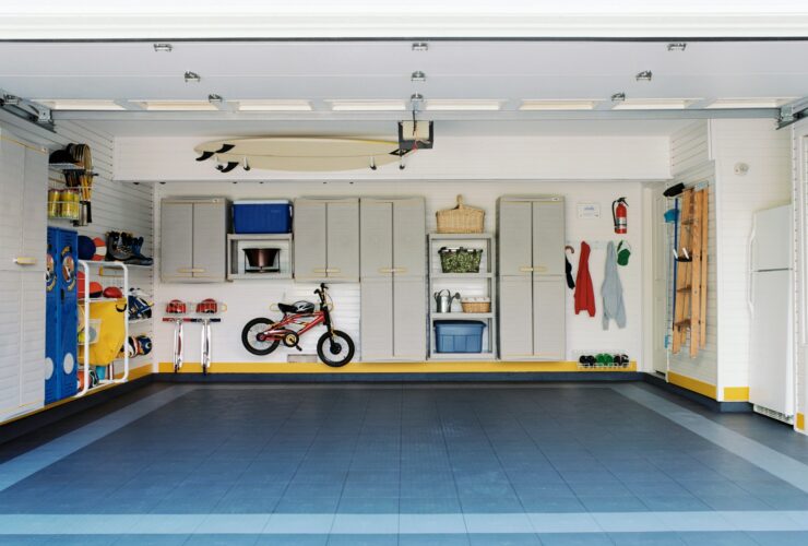 Surfboards and bicycles in empty garage