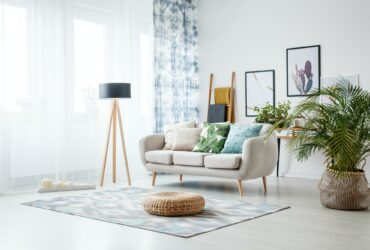 Black lamp standing by sofa