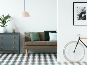 Chest of drawers next to a sofa with pillows and patterned floor