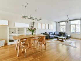 Chic dining room with wooden table and a painting on the wall