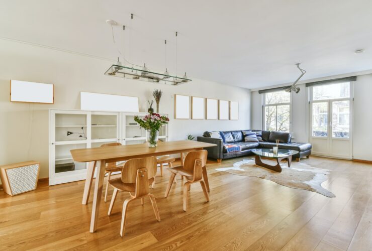 Chic dining room with wooden table and a painting on the wall