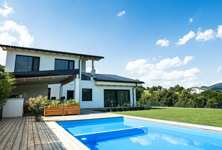 House with swimming pool outdoors in backyard garden