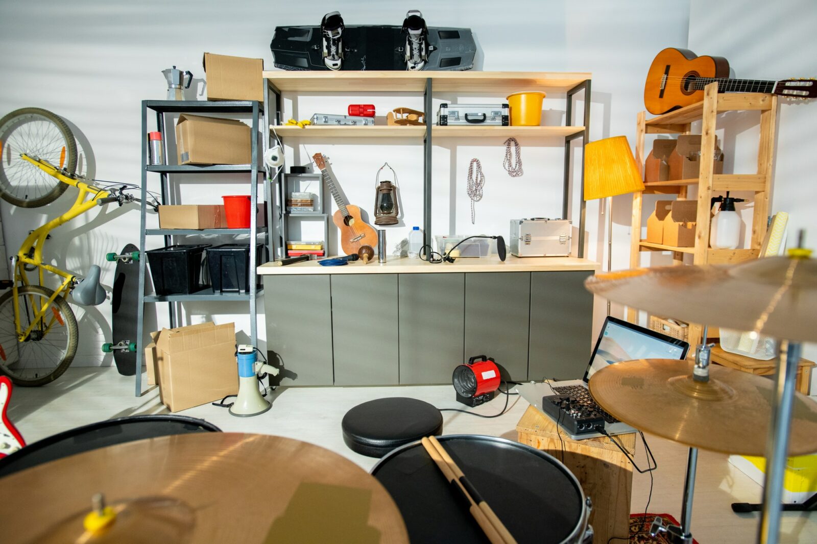 Interior of contemporary garage for rehearsals with drum kit and other stuff