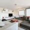 Lovely large living room with low upholstered sofas