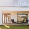 Modern garden furniture on the terrace of stylish suburban house with big green yard