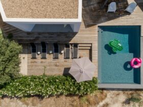 Modern house with garden swimming pool and wooden deck