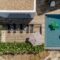 Modern house with garden swimming pool and wooden deck