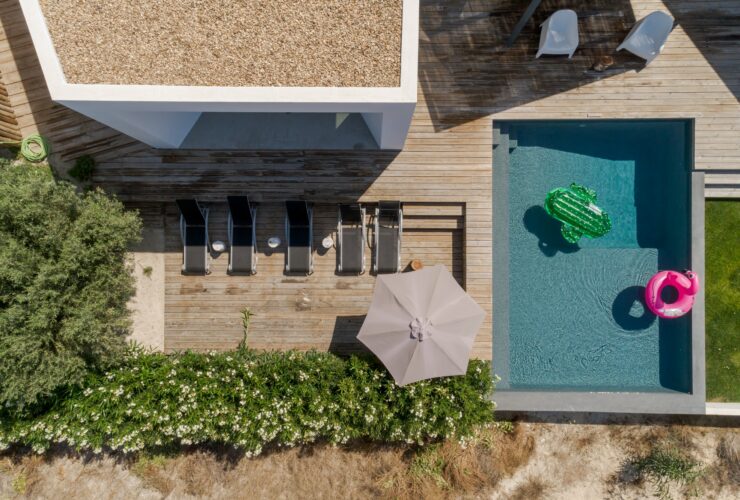 Modern house with garden swimming pool and wooden deck