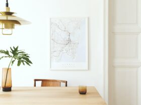 Stylish and eclectic dining room interior with mock up poster map.