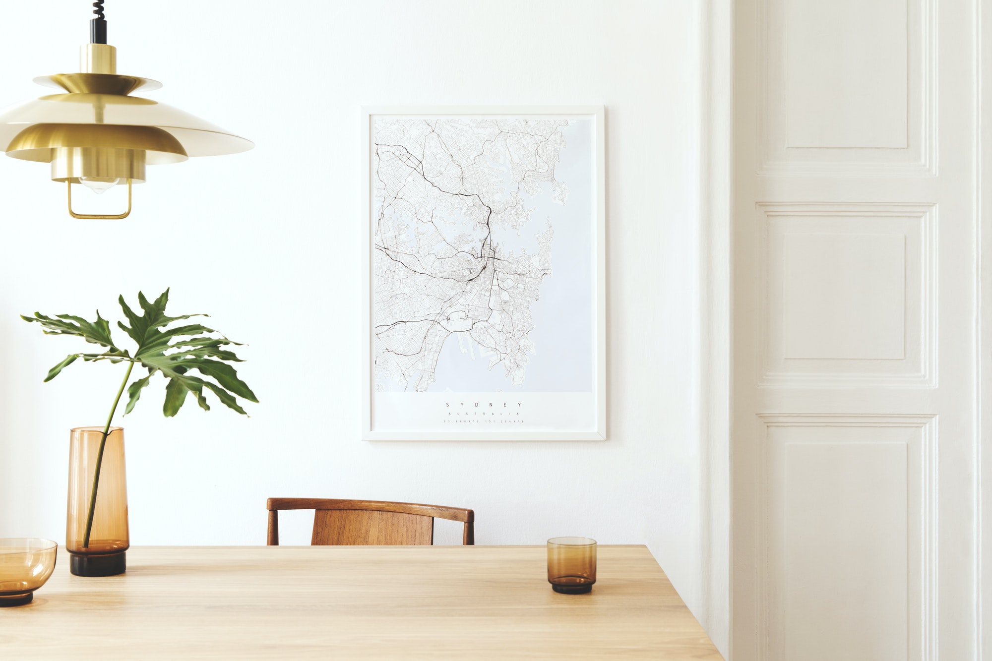 Stylish and eclectic dining room interior with mock up poster map.