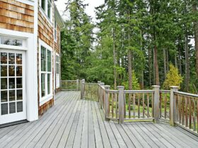 Wooden deck on house near forest