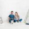 Young couple using laptop during home improvement