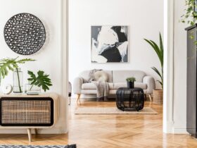 Creative modern home interior with painting, sofa, rattan commode.