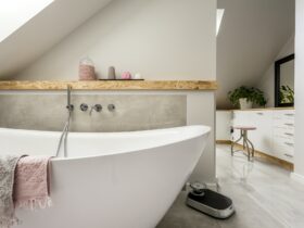 Freestanding bath in grey bathroom