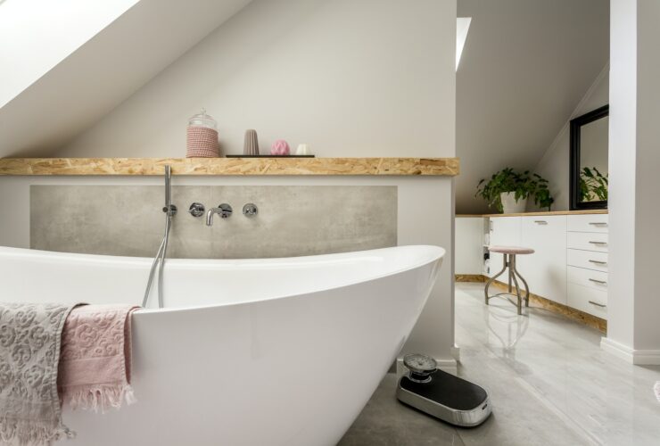 Freestanding bath in grey bathroom