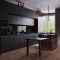 Modern dark kitchen and dinning room interior with furniture and kitchenware