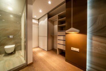 Modern interior, beautiful wardrobe without clothes. Empty wardrobe room with opened shelves