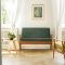 Real photo of a vintage living room interior with a green sofa,
