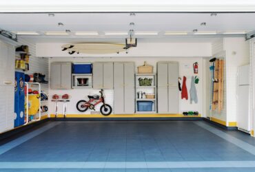 Surfboards and bicycles in empty garage