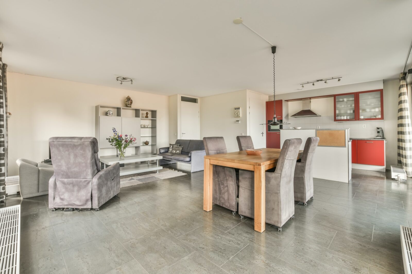 The interior of a spacious living room in an open design