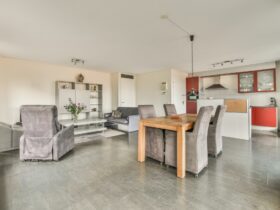 The interior of a spacious living room in an open design