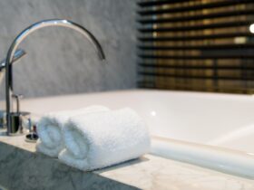 Bathroom towel on a white marble bathtub