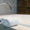 Bathroom towel on a white marble bathtub